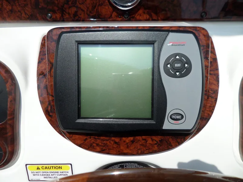 Slide: The Image of Dashboard display on 2005 Sea Ray 290 SS boat, featuring navigation controls. - 28