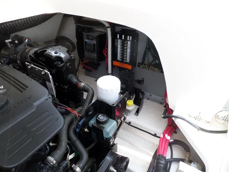 Slide: The Image of Engine compartment of 2005 Sea Ray 290 SS boat, showcasing mechanical components and wiring. - 43