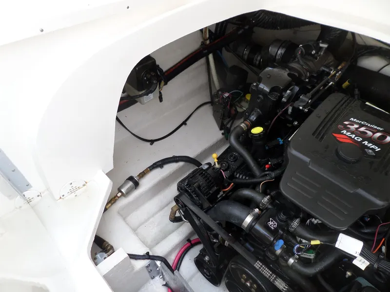 Slide: The Image of Engine compartment of 2005 Sea Ray 290 SS boat, showcasing MerCruiser 350 MAG MPI engine. - 45