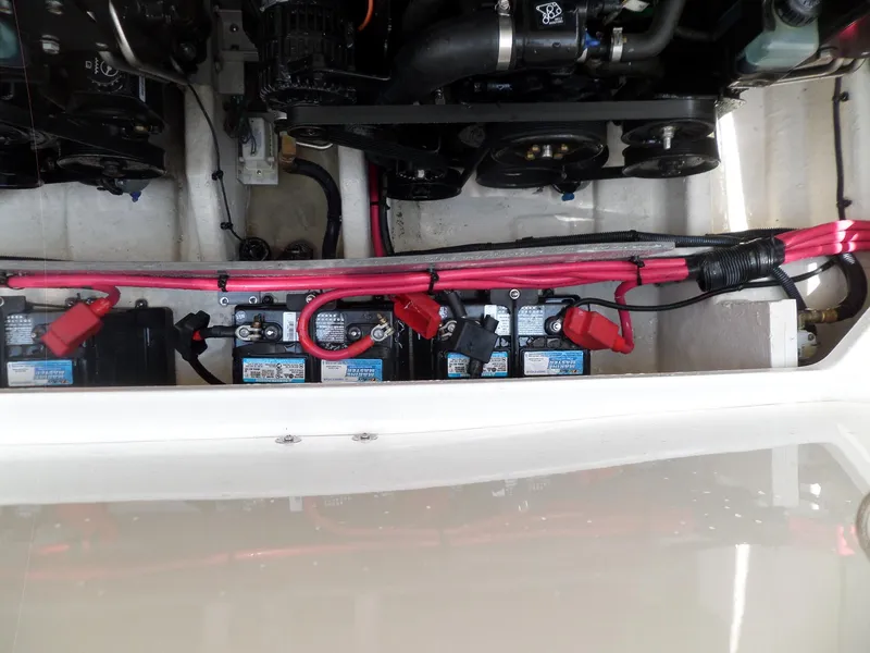 Slide: The Image of 2005 Sea Ray 290 SS engine compartment with visible batteries and wiring. - 47