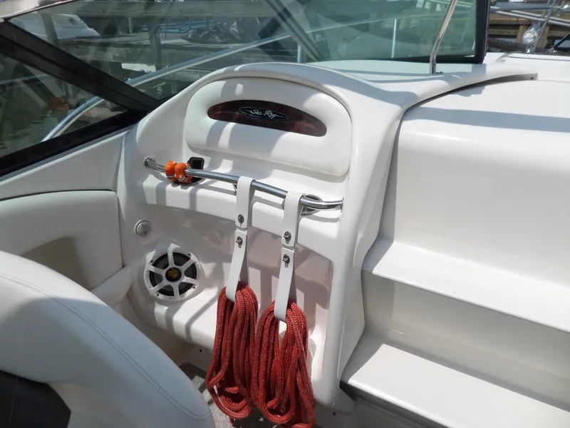 Slide: The Image of 2005 Sea Ray 290 SS boat interior with red ropes and speaker. - 9