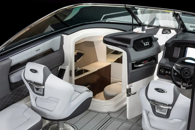 Slide: The Image of Interior of 2025 Chaparral 2870 boat, featuring modern helm and seating area. - 13