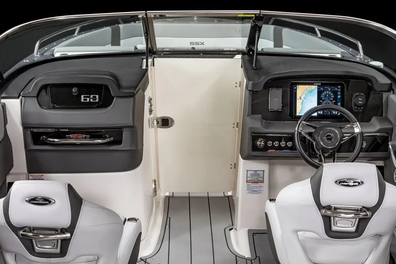 Slide: The Image of 2025 Chaparral 2870 boat interior with modern dashboard and steering wheel. - 18