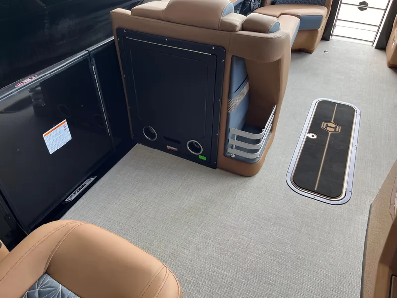 Slide: The Image of 2026 Harris Grand Mariner 250 interior with tan seating and sleek flooring. - 10