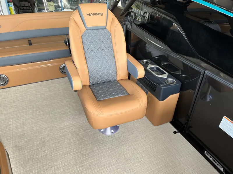 Slide: The Image of Luxurious seating in 2026 Harris Grand Mariner 250 boat, featuring tan and gray upholstery. - 14