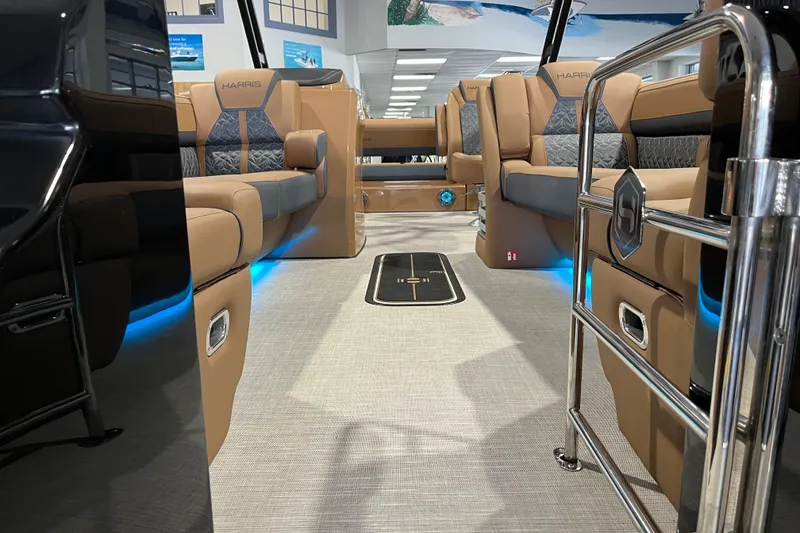 Slide: The Image of Luxurious interior of 2026 Harris Grand Mariner 250 pontoon boat with elegant seating and ambient lighting. - 2