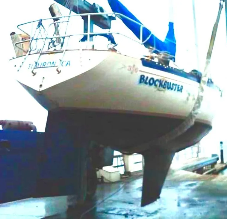 Slide: The Image of Interior of 1978 Islander Sloop 36 sailboat with wooden cabinetry and blue seating. - 7