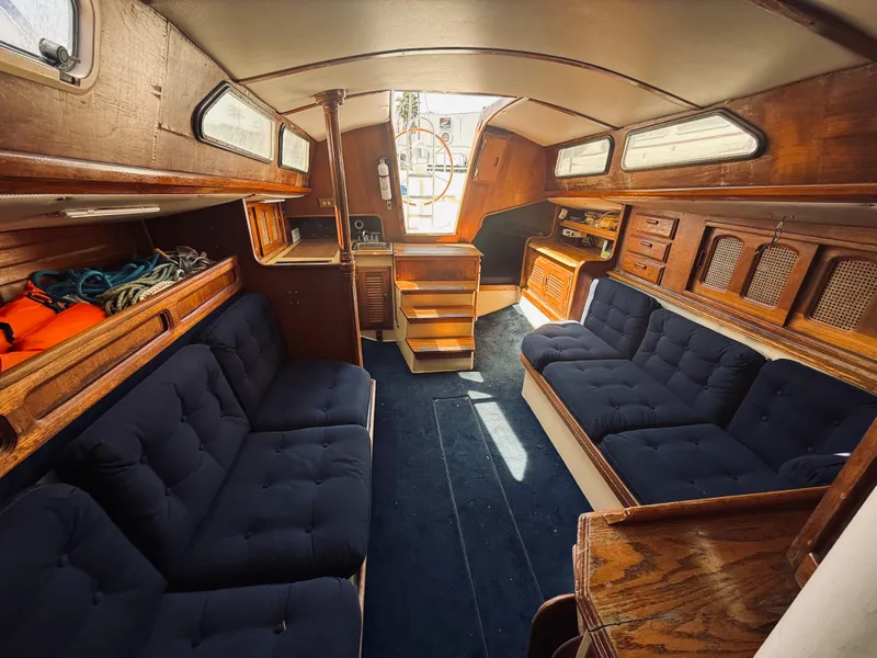 Slide: The Image of 1978 Islander Sloop 36 interior with wooden cabinetry and radio equipment. - 9