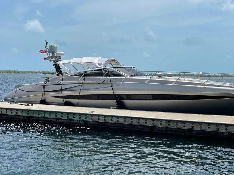 The Image of Luxury 2012 Riva Rivale yacht docked on calm water under clear skies. - 0