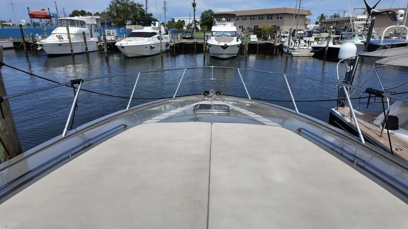 Slide: The Image of Bow view of 2012 Riva Rivale yacht docked in marina with other boats. - 11