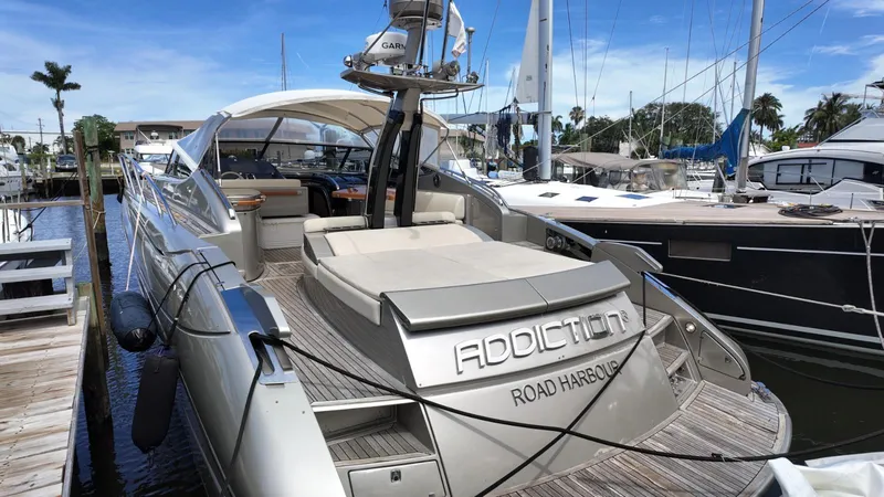 Slide: The Image of Luxury 2012 Riva Rivale yacht docked at marina, featuring sleek design and spacious deck. - 15