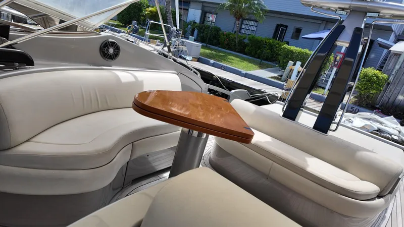 Slide: The Image of Luxurious 2012 Riva Rivale yacht interior with elegant seating and wooden table. - 16