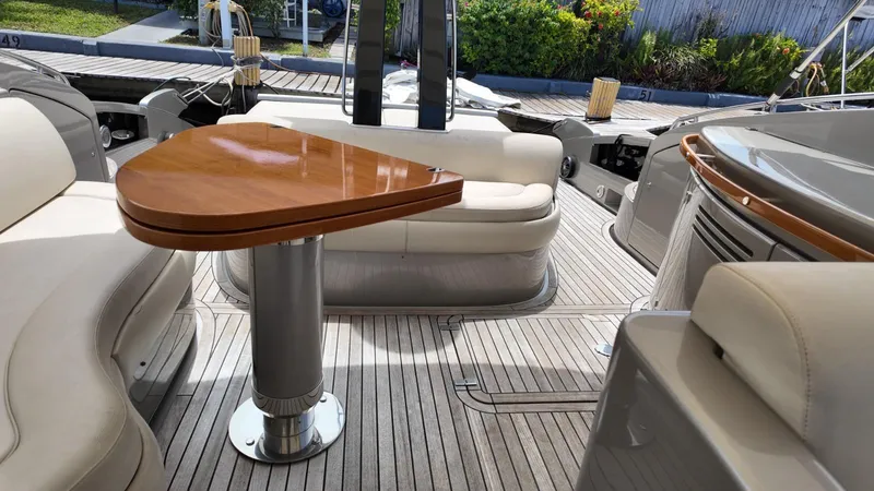 Slide: The Image of Luxurious 2012 Riva Rivale yacht interior with elegant seating and wooden table. - 19