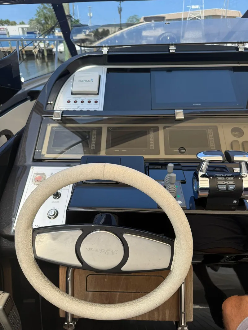Slide: The Image of Steering wheel and dashboard of a 2012 Riva Rivale yacht. - 21