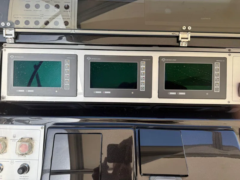 Slide: The Image of Control panel of a 2012 Riva Rivale yacht with three digital displays. - 22