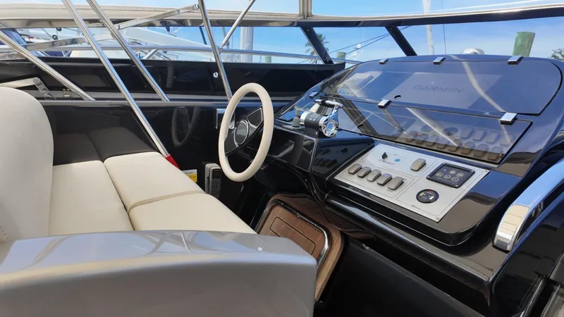 Slide: The Image of Luxurious 2012 Riva Rivale yacht cockpit with sleek controls and comfortable seating. - 24