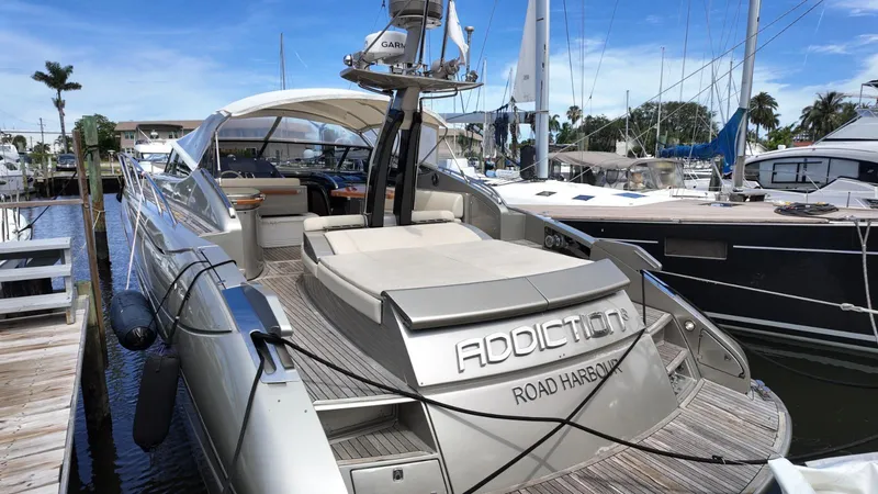 Slide: The Image of Luxury 2012 Riva Rivale yacht docked at marina, featuring sleek design and spacious deck. - 26