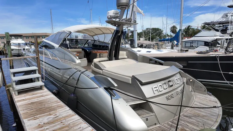 Slide: The Image of 2012 Riva Rivale yacht docked at marina under clear blue sky. - 27