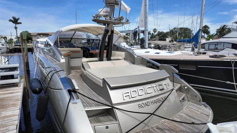 Slide: The Image of Luxury 2012 Riva Rivale yacht docked at marina, featuring sleek design and spacious deck. - 28