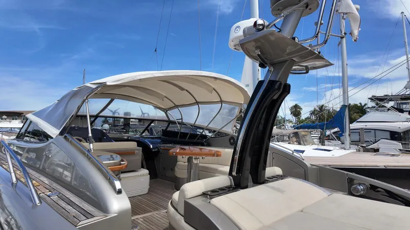 Slide: The Image of 2012 Riva Rivale yacht with sleek design, docked under clear blue sky. - 30