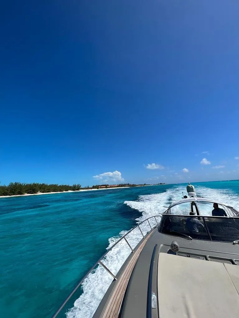 Slide: The Image of Luxury Riva Rivale 2012 yacht cruising on turquoise waters under clear blue sky. - 34