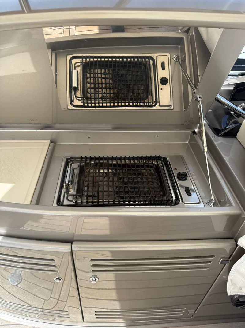 Slide: The Image of Outdoor grill setup on a 2012 Riva Rivale yacht, featuring dual cooking stations. - 35