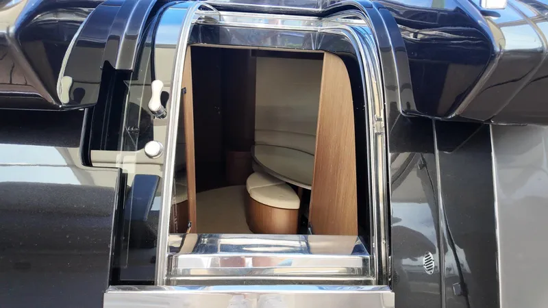 Slide: The Image of 2012 Riva Rivale yacht interior entrance with sleek design and wooden accents. - 38