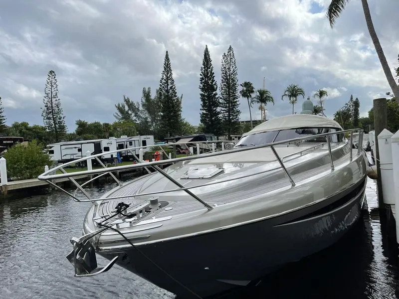 Slide: The Image of Luxury 2012 Riva Rivale yacht docked near palm trees and RVs. - 5