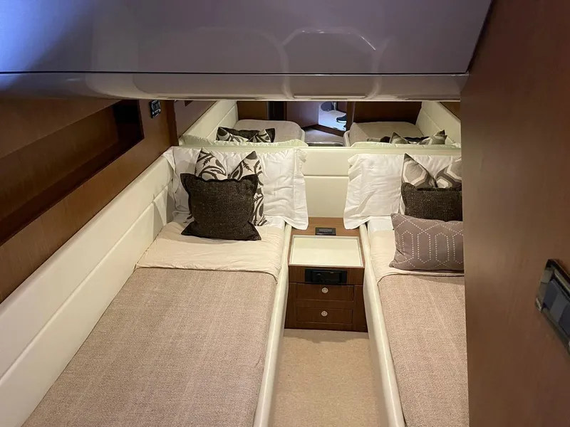 Slide: The Image of Luxurious 2012 Riva Rivale yacht cabin with twin beds and elegant decor. - 51