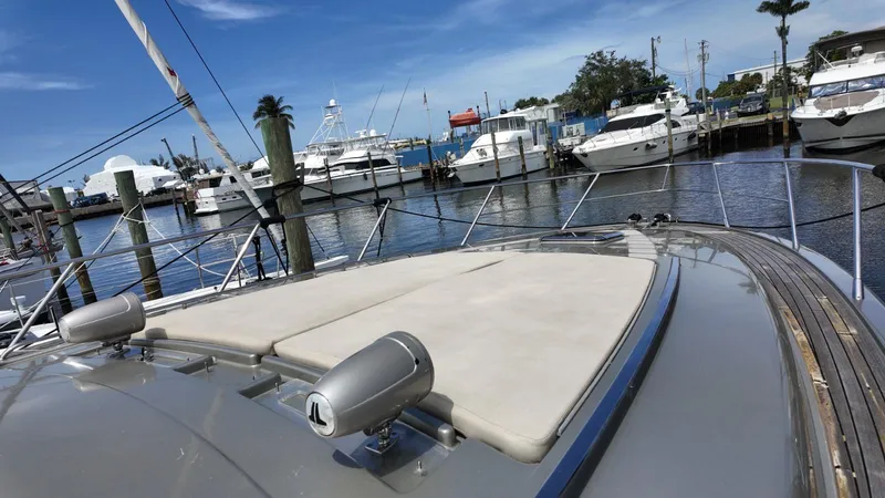 Slide: The Image of Luxury 2012 Riva Rivale yacht docked at marina, surrounded by other boats under clear blue sky. - 7