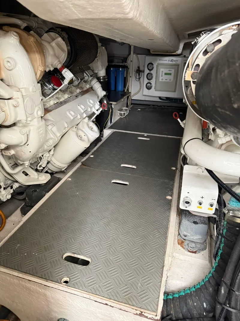 Slide: The Image of Engine room of a 2012 Riva Rivale yacht, showcasing mechanical components and equipment. - 85