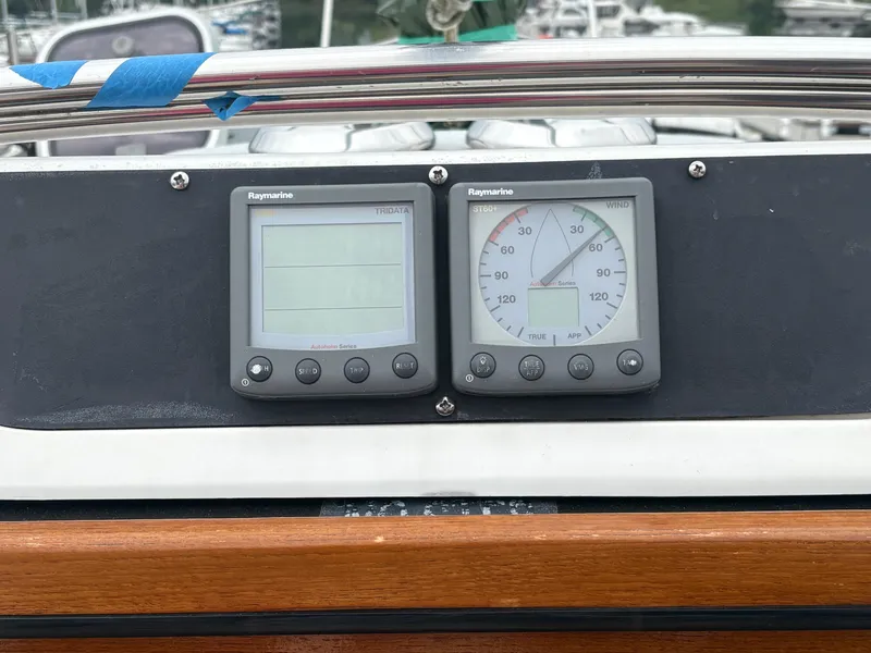 Slide: The Image of Raymarine instruments on a 1997 Hunter 310 sailboat dashboard. - 17