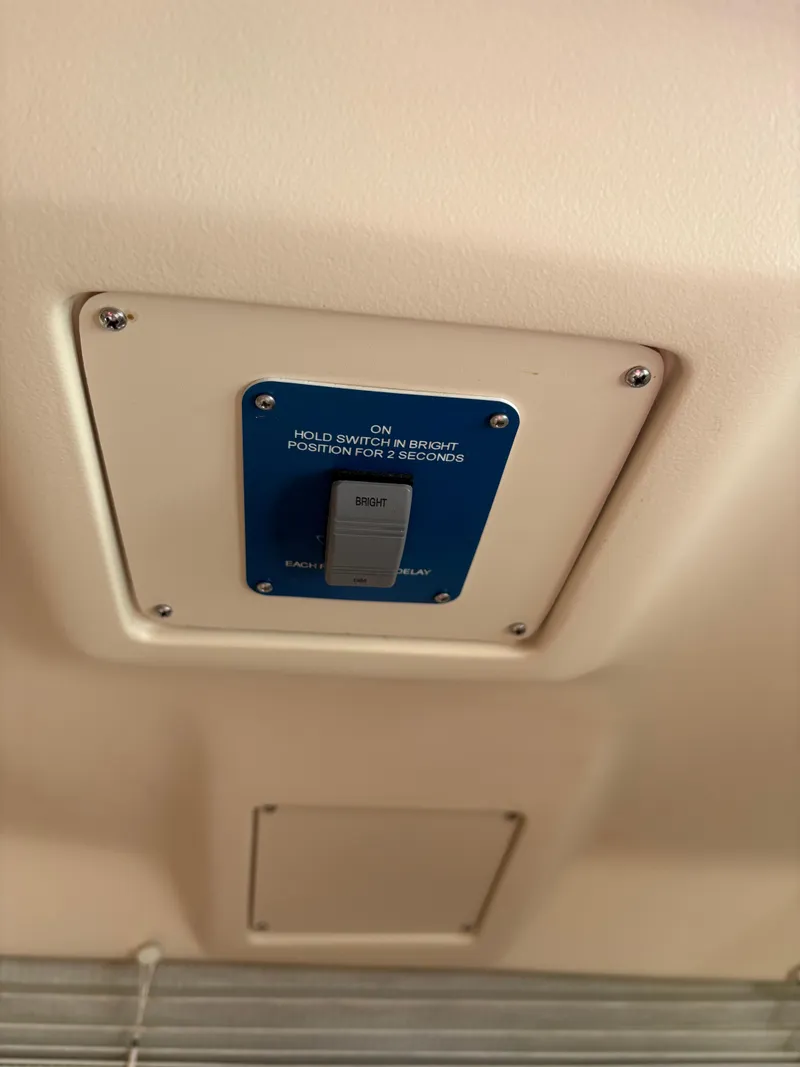 Slide: The Image of Switch panel on a 1997 Hunter 310 boat interior ceiling. - 20