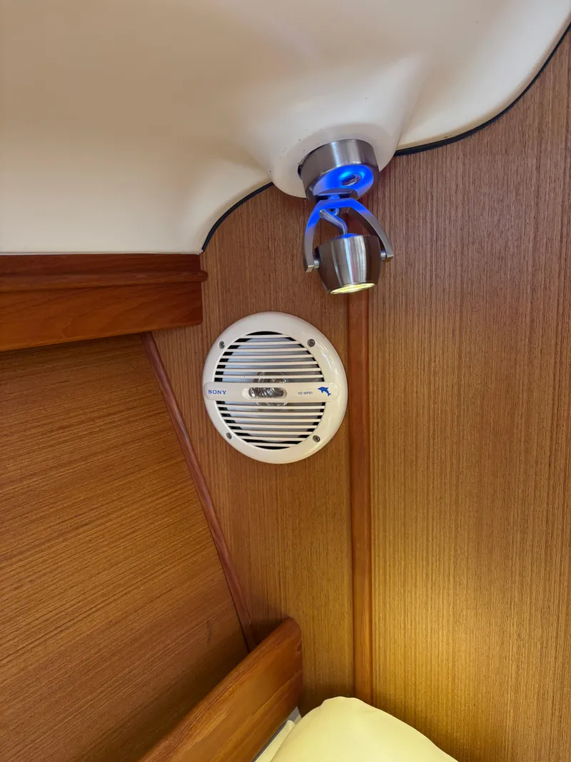 Slide: The Image of Interior of 1997 Hunter 310 sailboat with Sony speaker and modern light fixture. - 22
