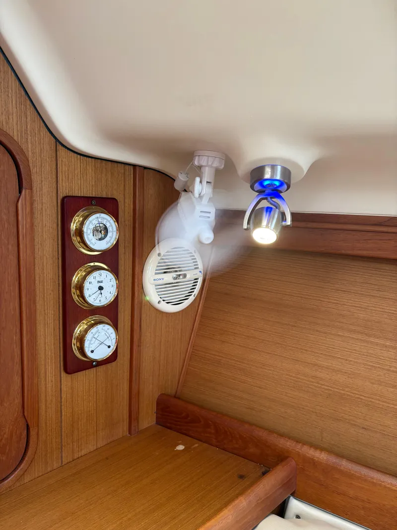 Slide: The Image of Interior of 1997 Hunter 310 yacht with gauges, speaker, and LED light. - 23