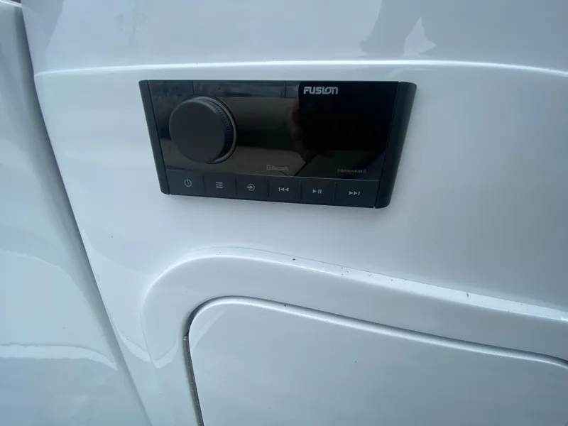 Slide: The Image of Control panel on 2020 Crest Savannah 250 SLRC boat, featuring Fusion audio system. - 14