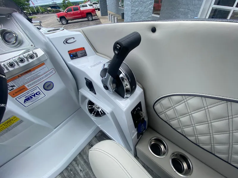 Slide: The Image of 2020 Crest Savannah 250 SLRC boat interior with control panel and luxurious seating. - 19