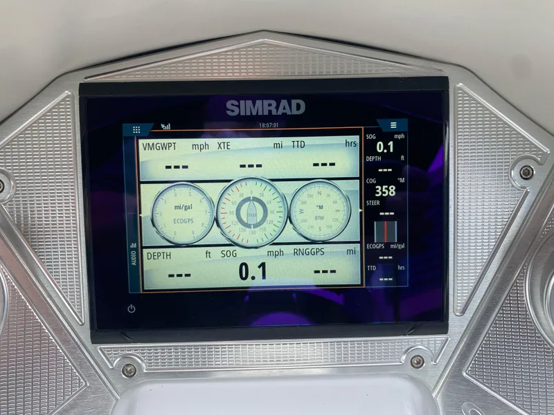 Slide: The Image of Simrad display on 2020 Crest Savannah 250 SLRC boat dashboard showing navigation data. - 21