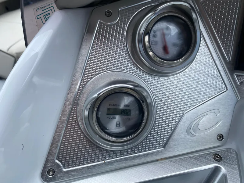 Slide: The Image of Dashboard of 2020 Crest Savannah 250 SLRC boat with gauges and metallic finish. - 22