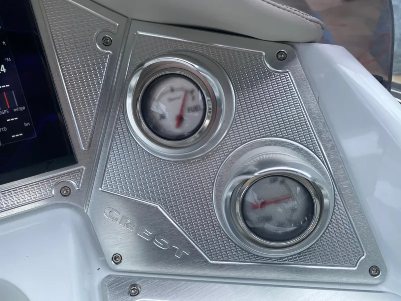 Slide: The Image of Dashboard of 2020 Crest Savannah 250 SLRC with gauges and metallic finish. - 23