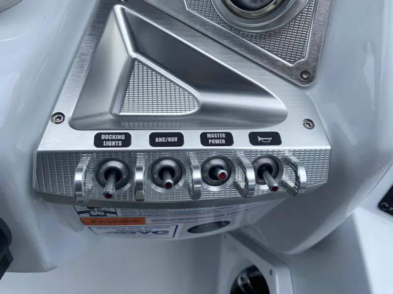 Slide: The Image of Control panel of 2020 Crest Savannah 250 SLRC with labeled switches for docking lights and power. - 24
