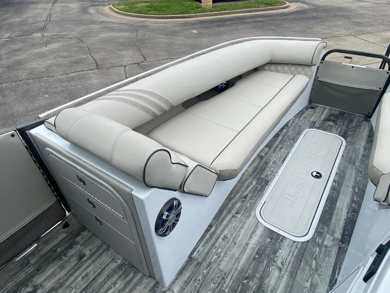 Slide: The Image of Luxurious seating on 2020 Crest Savannah 250 SLRC pontoon boat, featuring sleek design and premium materials. - 26