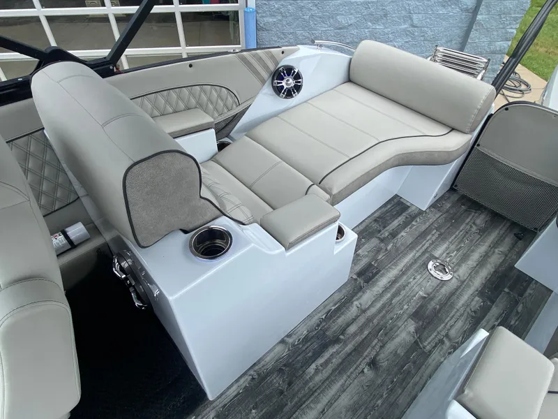 Slide: The Image of Luxurious seating on 2020 Crest Savannah 250 SLRC boat with modern design and cup holders. - 31