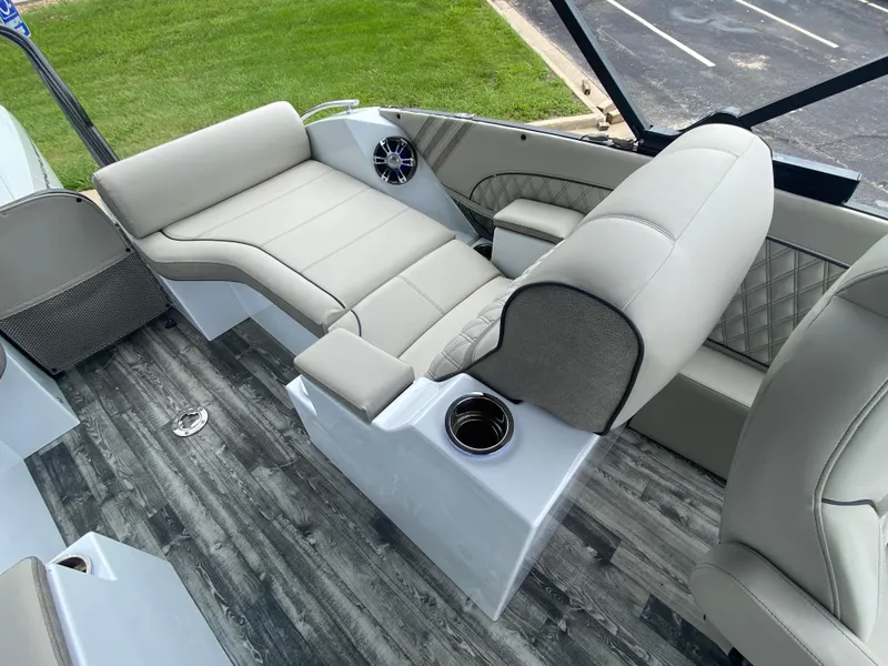 Slide: The Image of Luxurious seating on 2020 Crest Savannah 250 SLRC boat with modern design and cup holders. - 32