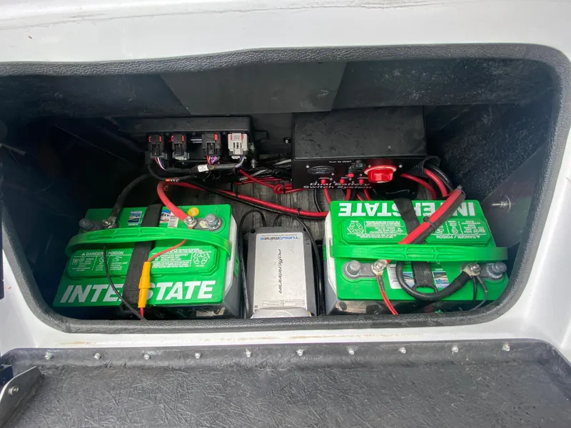 Slide: The Image of Battery compartment of 2020 Crest Savannah 250 SLRC with Interstate batteries and wiring. - 36