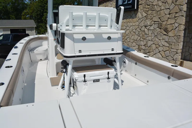 Slide: The Image of 2026 Blackfin 262 HB boat interior with seating and storage, featuring a Yeti cooler. - 14