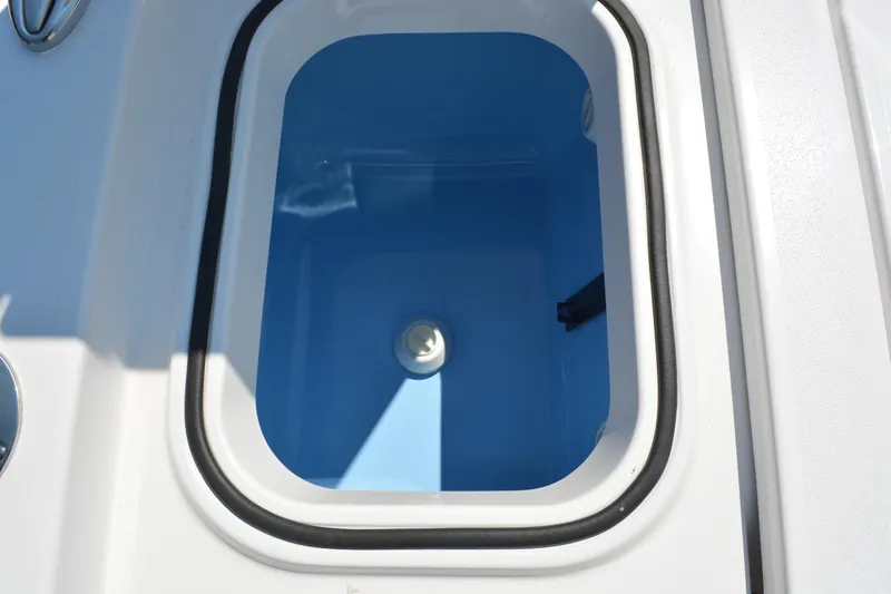 Slide: The Image of Livewell compartment on 2026 Blackfin 262 HB boat, featuring a blue interior. - 17