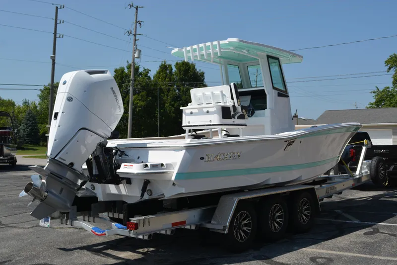 Slide: The Image of 2026 Blackfin 262 HB boat on trailer, featuring a powerful outboard motor. - 3