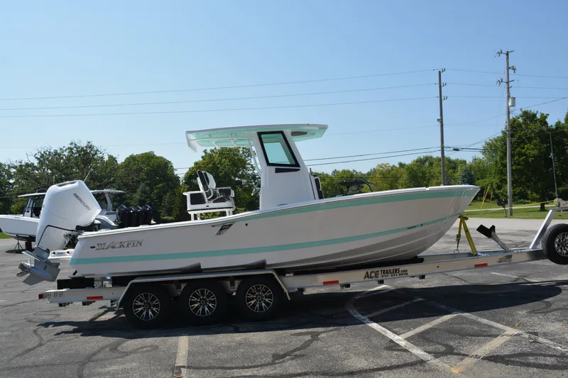 Slide: The Image of 2026 Blackfin 262 HB boat on trailer in parking lot, side view. - 5