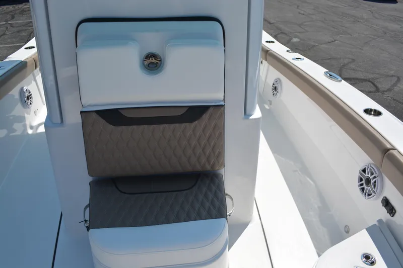 Slide: The Image of 2026 Blackfin 262 HB boat interior with cushioned seating and sleek design. - 9
